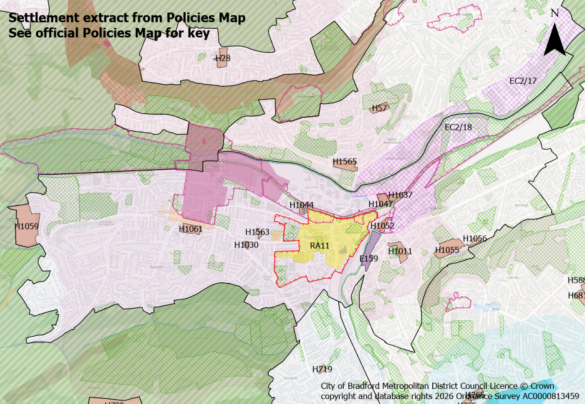 Map showing a settlement area with colour-coded zones and programme area labels, overlaid with grid references and roads.